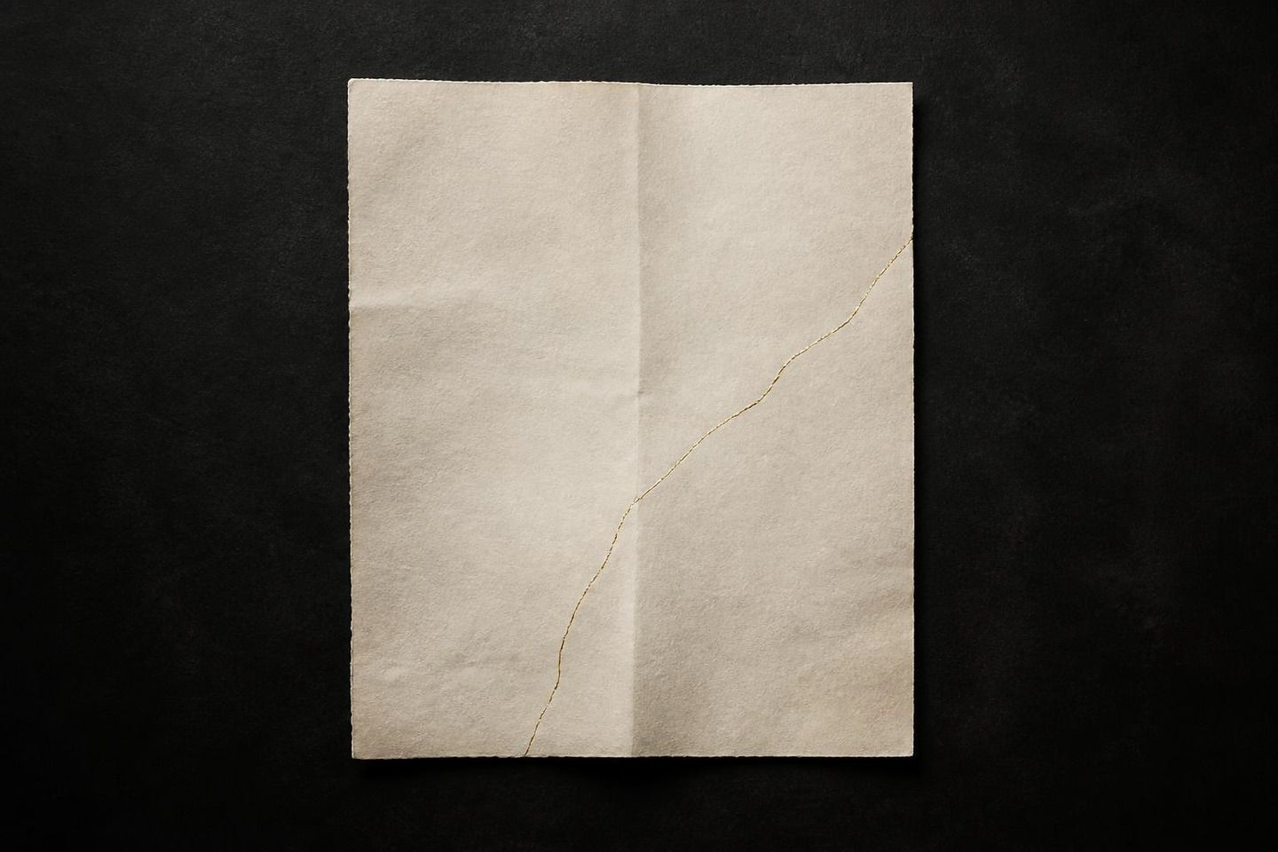 VALÉORINE editorial artwork: an ivory sheet with a delicate crease and a fissure traced in gold