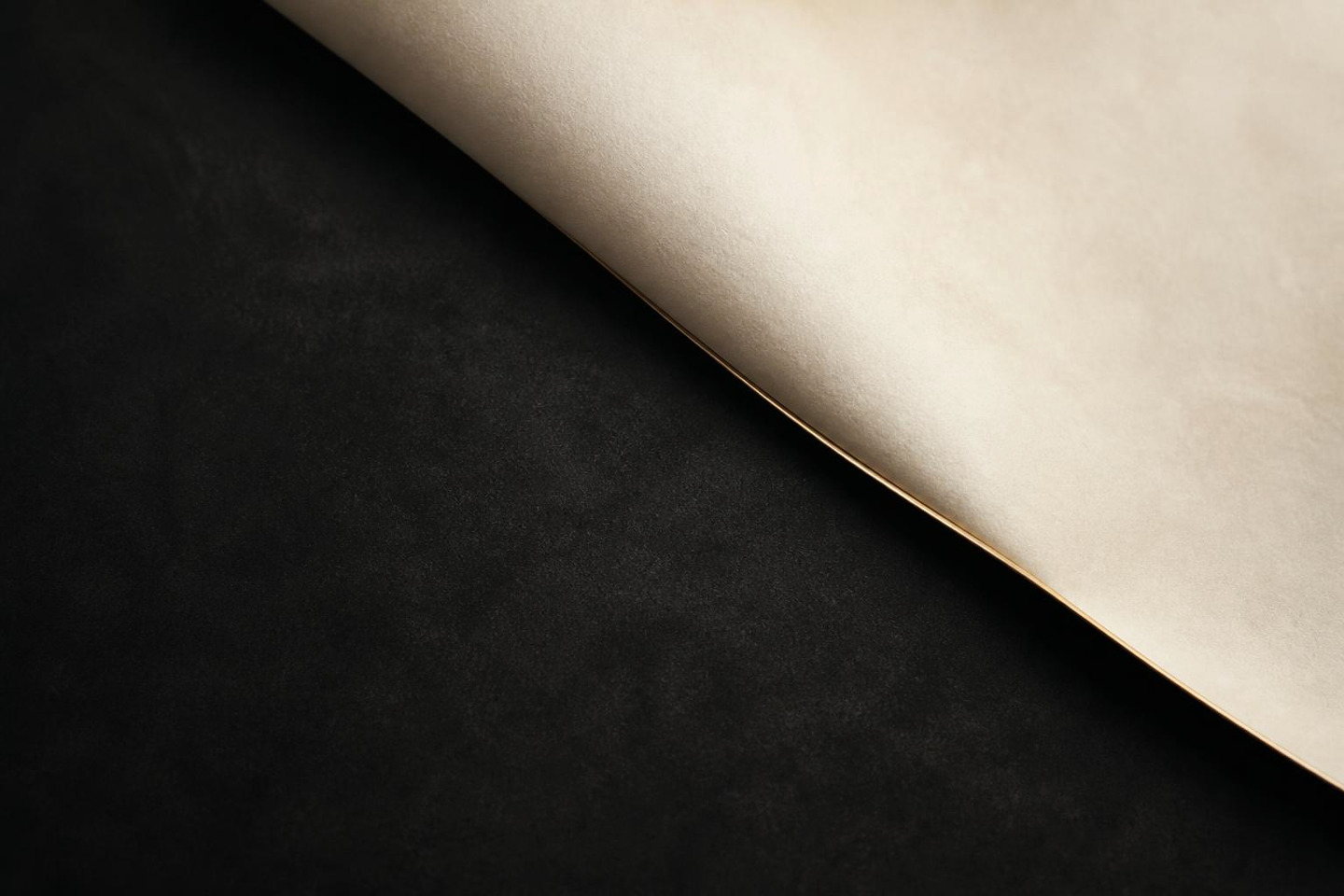 VALÉORINE editorial artwork: one quiet ivory fold meeting a fine gold seam on charcoal
